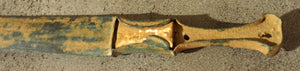 Bronze dagger with limestone inlay.